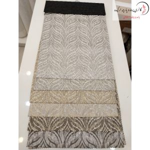 پارچه ژاکارد سیم‌ دوزی شده با طرح‌های برجسته و جزئیات ظریف، مناسب برای پرده‌های لوکس